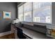 Cozy home office with a built in desk, natural light, and dark gray paint at 958 Austin Ne Ave, Atlanta, GA 30307