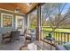 Inviting covered patio featuring comfortable seating and views of the lush green lawn at 958 Austin Ne Ave, Atlanta, GA 30307