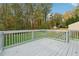 Back deck and fenced yard offers a serene outdoor retreat with green space at 1277 Muirforest Dr, Stone Mountain, GA 30088
