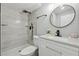 Updated bathroom with granite counters, modern fixtures, and tiled shower at 1277 Muirforest Dr, Stone Mountain, GA 30088