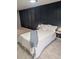 Bedroom featuring accent wall with neutral decor at 1277 Muirforest Dr, Stone Mountain, GA 30088