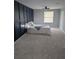Comfortable carpeted bedroom features a dark blue accent wall and a ceiling fan at 1277 Muirforest Dr, Stone Mountain, GA 30088