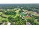Aerial view shows the surrounding area including golf course, baseball fields, and community park at 272 Lake Forrest Ne Ln, Atlanta, GA 30342