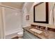 Bathroom with a tub and shower combination, a granite countertop, and a modern sink at 272 Lake Forrest Ne Ln, Atlanta, GA 30342