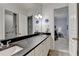 Spacious bathroom featuring a dual vanity with granite countertop and access to a separate room at 272 Lake Forrest Ne Ln, Atlanta, GA 30342