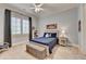 Serene bedroom featuring natural light, neutral walls, and a cozy sitting area with blackout curtains at 272 Lake Forrest Ne Ln, Atlanta, GA 30342
