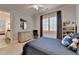 Charming bedroom with light grey walls, and car-themed decorations with ample natural light at 272 Lake Forrest Ne Ln, Atlanta, GA 30342