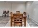 Inviting dining area featuring a wooden table, seating for six, and stylish bar stools for casual gatherings at 272 Lake Forrest Ne Ln, Atlanta, GA 30342