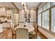 Dining area showcasing a large table, and shutter-style blinds for natural light at 272 Lake Forrest Ne Ln, Atlanta, GA 30342