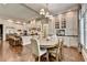 Open-concept kitchen and dining area with bar stool seating at the kitchen island at 272 Lake Forrest Ne Ln, Atlanta, GA 30342