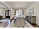Spacious dining area showing hardwood flooring, a chandelier, unique ceiling, and designer decor at 272 Lake Forrest Ne Ln, Atlanta, GA 30342