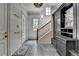 Entryway with slate tile, coat hooks, and a built-in storage unit for organization at 272 Lake Forrest Ne Ln, Atlanta, GA 30342