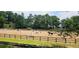 An expansive equestrian area with fences, jumps, and ample space for riding at 272 Lake Forrest Ne Ln, Atlanta, GA 30342