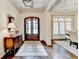 Elegant foyer boasts hardwood floors, a stylish rug, and views into the dining room at 272 Lake Forrest Ne Ln, Atlanta, GA 30342