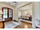 Inviting foyer features a hardwood floor, vintage sideboard and entrance into dining area at 272 Lake Forrest Ne Ln, Atlanta, GA 30342