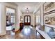 Grand foyer showcases hardwood floors, detailed trim, and access to the living spaces at 272 Lake Forrest Ne Ln, Atlanta, GA 30342