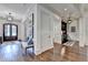 Welcoming foyer showcasing hardwood floors and an elegant bench next to a home bar at 272 Lake Forrest Ne Ln, Atlanta, GA 30342