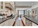 Open concept kitchen featuring an island and stainless steel appliances, with an adjacent dining area at 272 Lake Forrest Ne Ln, Atlanta, GA 30342