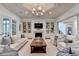 Cozy living room with a fireplace flanked by built-in bookshelves and comfortable seating at 272 Lake Forrest Ne Ln, Atlanta, GA 30342