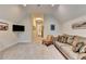 Cozy living room with a comfortable sofa and a wall-mounted TV at 272 Lake Forrest Ne Ln, Atlanta, GA 30342