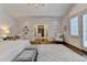 Bright and airy main bedroom featuring a walk-in closet, shutters, and stylish furnishings at 272 Lake Forrest Ne Ln, Atlanta, GA 30342