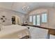 Beautiful bedroom showcasing the vaulted ceilings, closet access, and natural light throughout at 272 Lake Forrest Ne Ln, Atlanta, GA 30342