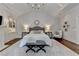 Inviting main bedroom with elegant décor, including a chandelier, fireplace, and neutral color scheme at 272 Lake Forrest Ne Ln, Atlanta, GA 30342