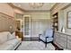 Warm and inviting office space with custom wall trim, built-in shelves and neutral tones at 272 Lake Forrest Ne Ln, Atlanta, GA 30342