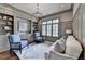 Cozy office with custom built-ins, a plush rug, and ample natural light at 272 Lake Forrest Ne Ln, Atlanta, GA 30342