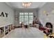 Spacious playroom filled with toys, featuring large windows for ample natural light at 272 Lake Forrest Ne Ln, Atlanta, GA 30342