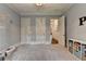 Playroom with three closets and neutral carpet, offering ample space for activities and storage at 272 Lake Forrest Ne Ln, Atlanta, GA 30342