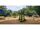 A vibrant community playground featuring slides, climbing structures, and a soft landing surface at 272 Lake Forrest Ne Ln, Atlanta, GA 30342