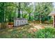 Large backyard with a fire pit, swing set, and storage shed at 2985 Westbury Dr, Decatur, GA 30033