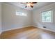 Bright bedroom features hardwood floors and two windows at 2985 Westbury Dr, Decatur, GA 30033
