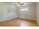 Bedroom with hardwood floors, white walls, and a ceiling fan at 2985 Westbury Dr, Decatur, GA 30033