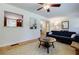 Open-concept living room with a pass-through to the kitchen and comfortable furnishings at 2985 Westbury Dr, Decatur, GA 30033
