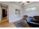 Relaxing sitting room with comfortable chairs, hardwood floors, and a tranquil view from the window at 2985 Westbury Dr, Decatur, GA 30033