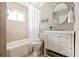 Bright bathroom with a tub and shower combination and a stylish vanity creates a functional and aesthetically pleasing space at 136 Peachtree Memorial Nw Dr # Nh4, Atlanta, GA 30309