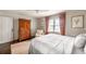 Comfortable bedroom with a ceiling fan, natural light, and hardwood floors provides a warm and inviting atmosphere at 136 Peachtree Memorial Nw Dr # Nh4, Atlanta, GA 30309