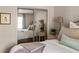 Bright bedroom with large mirrored closets, natural light, and a sitting area creates a relaxing retreat at 136 Peachtree Memorial Nw Dr # Nh4, Atlanta, GA 30309