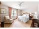 Cozy bedroom with a plush bed, neutral tones, and a comfortable armchair at 136 Peachtree Memorial Nw Dr # Nh4, Atlanta, GA 30309