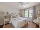 Bright bedroom featuring neutral tones, natural light, and a cozy seating area creates a relaxing retreat at 136 Peachtree Memorial Nw Dr # Nh4, Atlanta, GA 30309