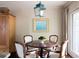Cozy dining area with modern light fixture and view of the outdoor space at 136 Peachtree Memorial Nw Dr # Nh4, Atlanta, GA 30309