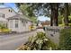 Entrance to Townegate community with a guardhouse and well-maintained landscaping at 136 Peachtree Memorial Nw Dr # Nh4, Atlanta, GA 30309
