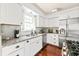 Bright kitchen featuring white cabinetry, stainless steel appliances, and granite countertops at 136 Peachtree Memorial Nw Dr # Nh4, Atlanta, GA 30309