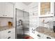 Well-designed kitchen with stainless steel refrigerator and custom shelving at 136 Peachtree Memorial Nw Dr # Nh4, Atlanta, GA 30309