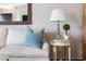 Close-up of a stylish living room with a comfortable sofa, elegant lamps, and tasteful decor at 136 Peachtree Memorial Nw Dr # Nh4, Atlanta, GA 30309