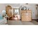 Inviting living room with hardwood floors, wooden furniture, and a view into the dining area at 136 Peachtree Memorial Nw Dr # Nh4, Atlanta, GA 30309