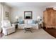 Elegant living room featuring a comfortable sofa, stylish lamps, and a neutral color palette at 136 Peachtree Memorial Nw Dr # Nh4, Atlanta, GA 30309
