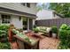 Inviting brick patio with comfortable seating, lush greenery, and easy access to indoor living at 136 Peachtree Memorial Nw Dr # Nh4, Atlanta, GA 30309